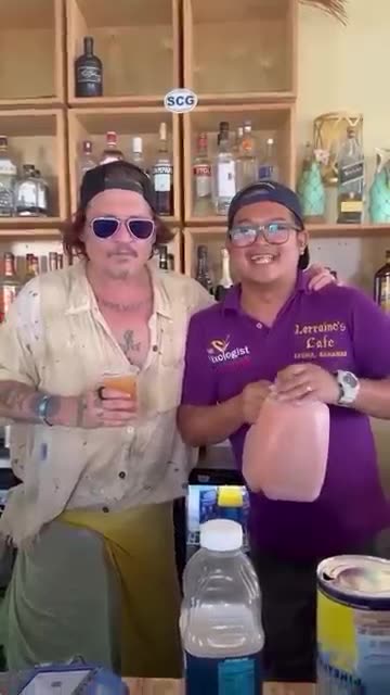 Johnny Depp drinking Rum at a local Café in the Caribbean
