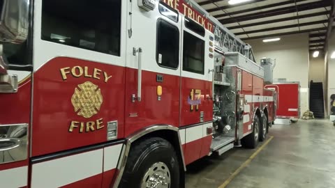 Polishing all the metal and paint on a Ladder truck for the Foley Fire Department