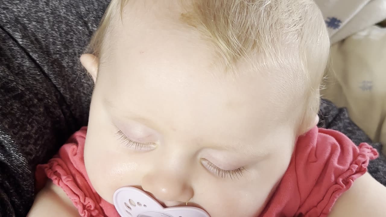 baby kayla sleeps in mommy’s lap — peaceful nap moment
