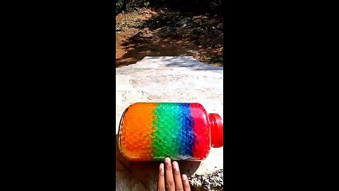 Incredible different colours of bottles falling from stairs to check hardness