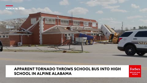 WATCH: Possible Tornado Throws School Bus Into Side Of High School In Talladega County, Alabama