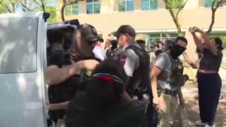 Masked federal agents now wait outside the courts to arrest illegal immigrants.