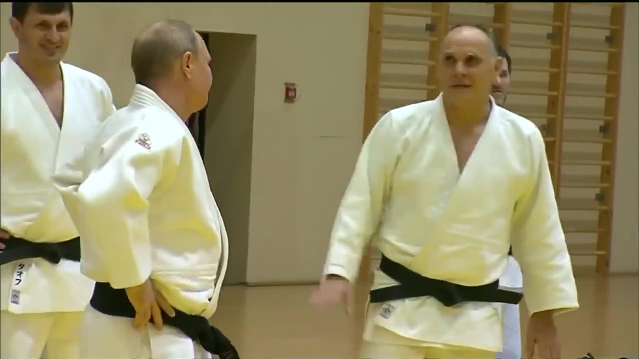 Black belt Putin shows off judo moves with Olympic athletes