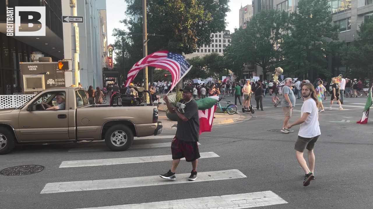 "We Sponsor Peaceful Protest," Says Flag-Carrying Man at Texas "No Kings" Protest