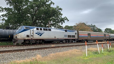 Amtrak 88 slides along slow train !
