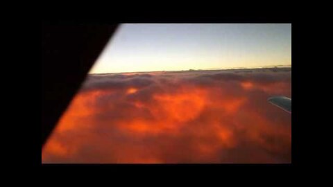 "Experience the Majesty: Sunrise beneath Clouds at FL280 - A Sky-High Adventure"