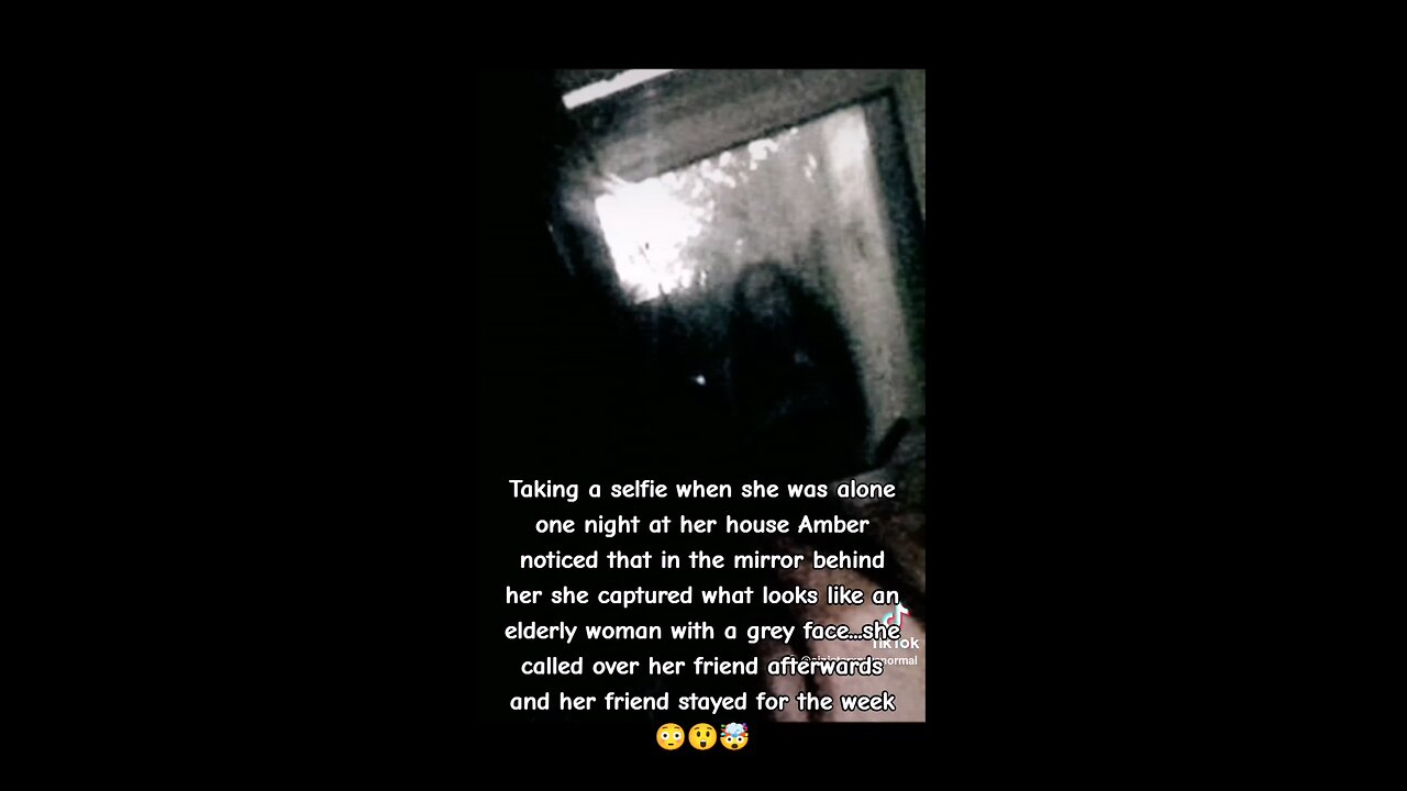 Dark ghost captured behind woman