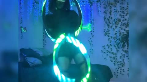 Sexy Catwoman LED Hoop Dance in Glowing Room – Mesmerizing Performance!