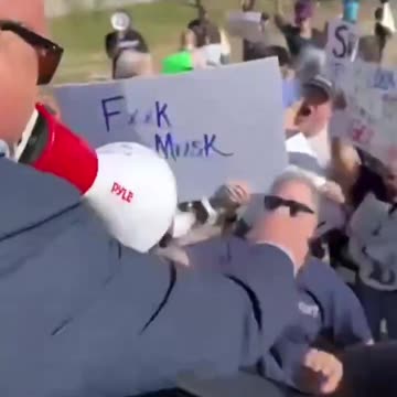 Alex Jones vs. Leftists at Tesla: Epic Confrontation!