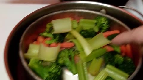 Steaming vegetables.