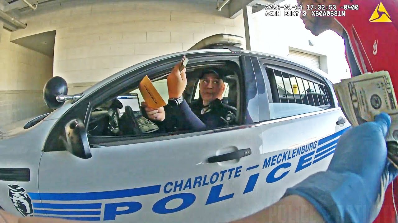 Charlotte Cop Caught on Camera Stealing Cash From a Detainee#3338