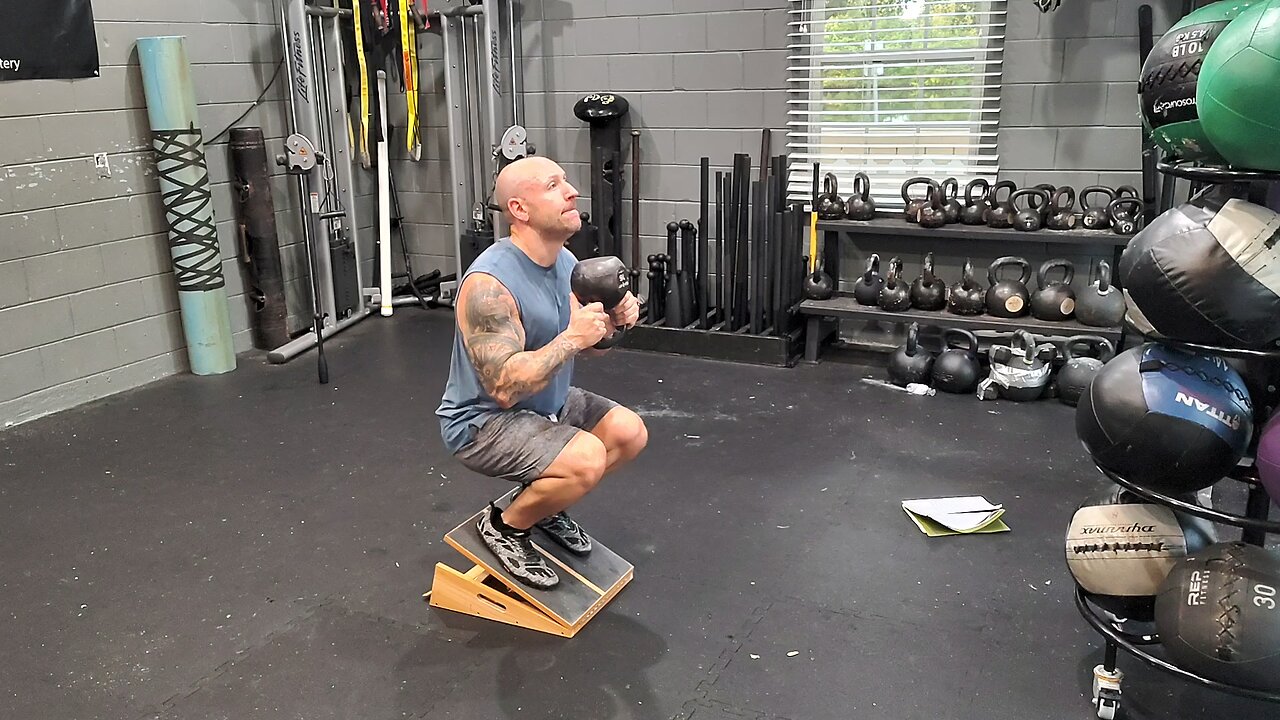 Slant Board Knees Over Toes Squat