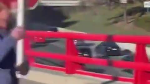 Crazy guy blocking road in Chicago, demanding drivers pay toll