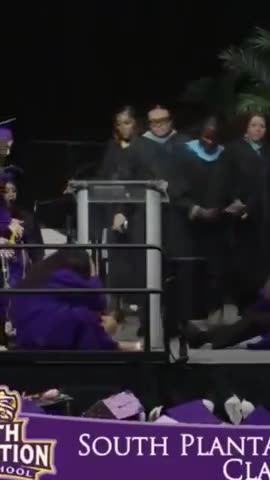 More Black Graduation Idiocy Graduate Backflips Into Another's Face