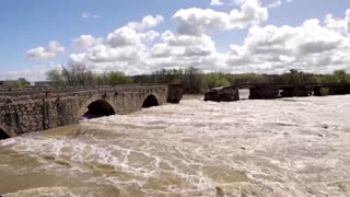 Historic bridge collapses after heavy rain hits central Spain