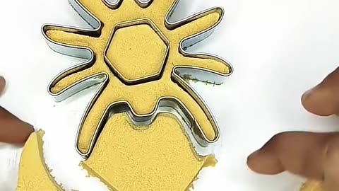 A spider takes shape from yellow sand ✨