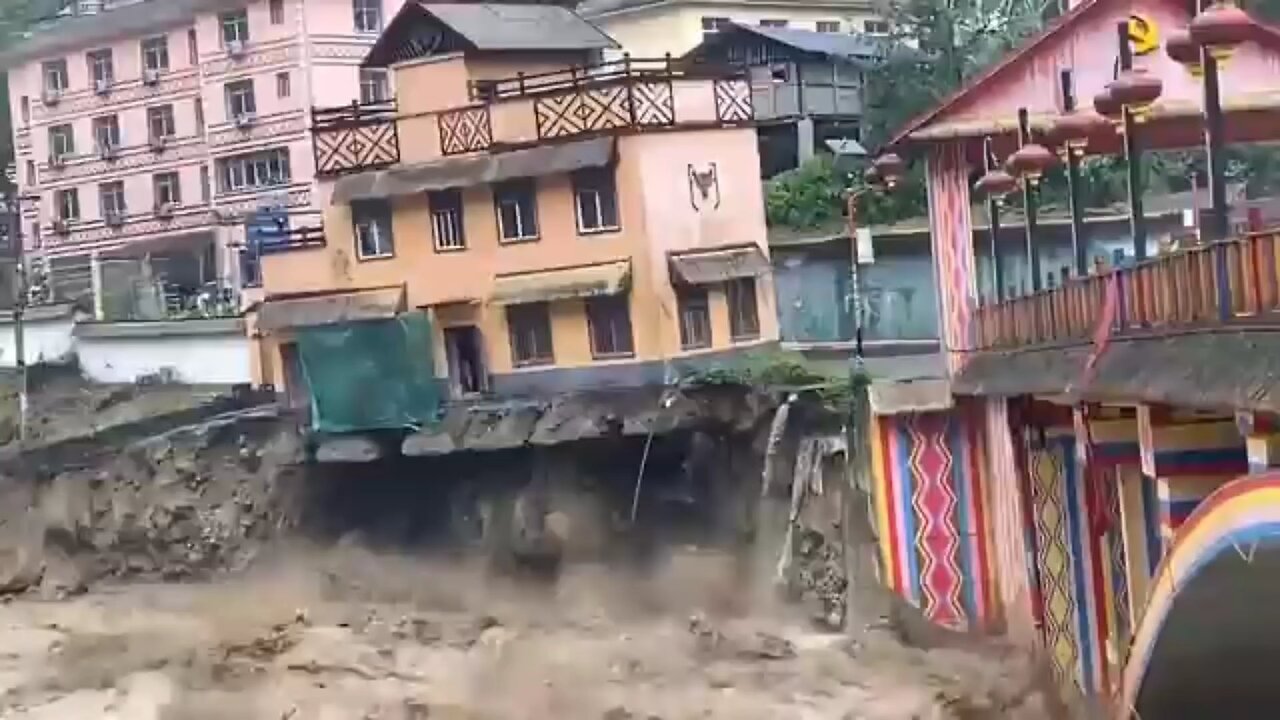 Riverside houses collapse after heavy rainfall hits Southwestern China