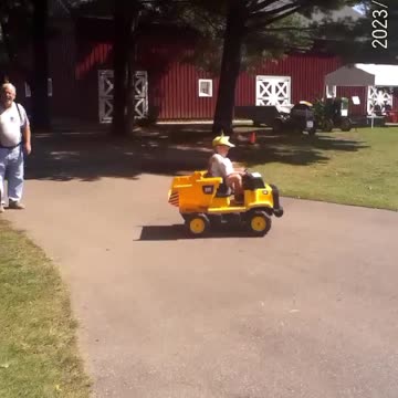 Kid Showing Off On Power Wheels