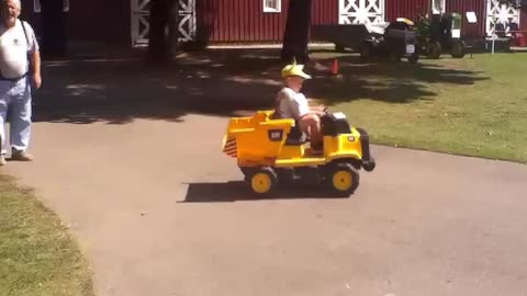 Kid Showing Off On Power Wheels