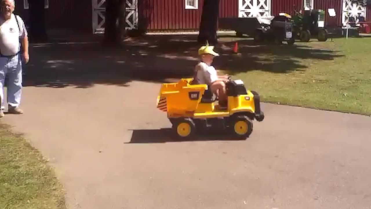 Kid Showing Off On Power Wheels