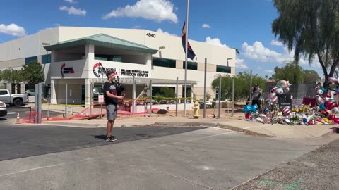 Young man plays the bagpipes at Turning Point USA HQ as a memorial for Charlie Kirk