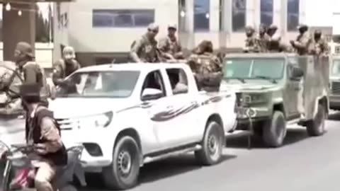 ISIS's Black Flag on the Arms of Syrian Rebels