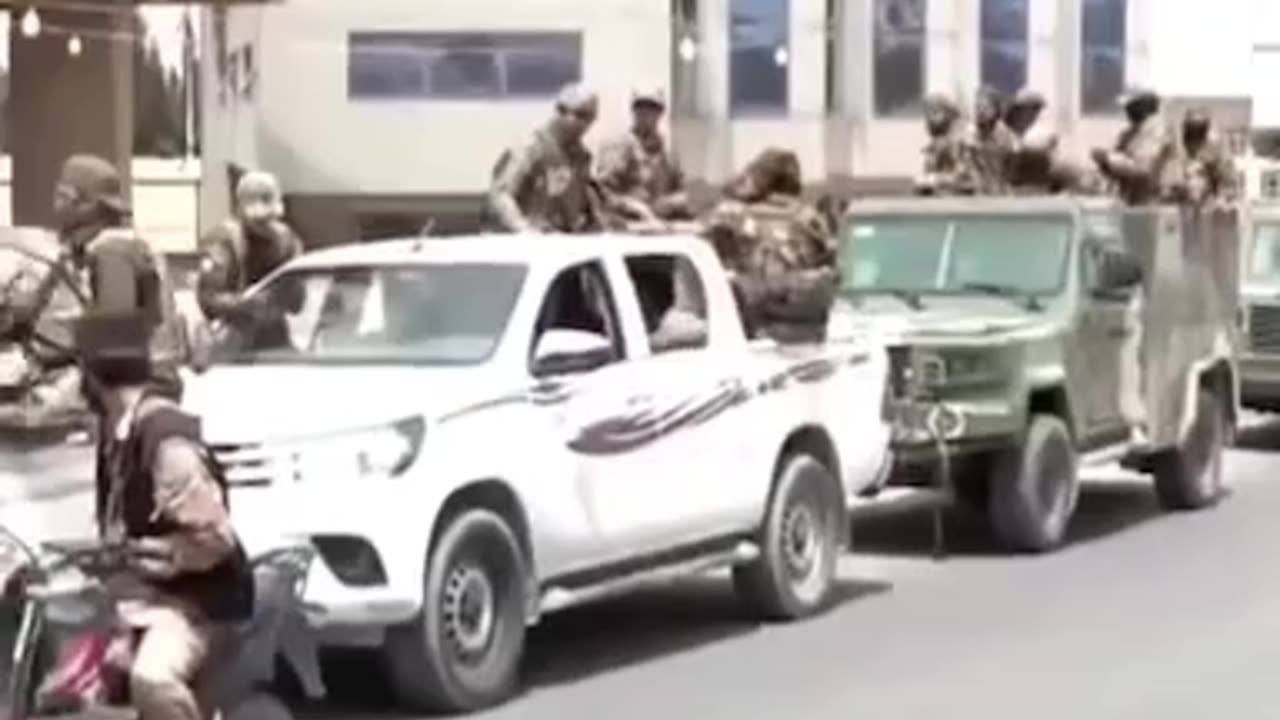 ISIS's Black Flag on the Arms of Syrian Rebels