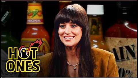 Dakota Johnson is not okay while eating spicy wings