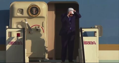 President Trump Puts on a USA Hat as He Arrives in the Netherlands