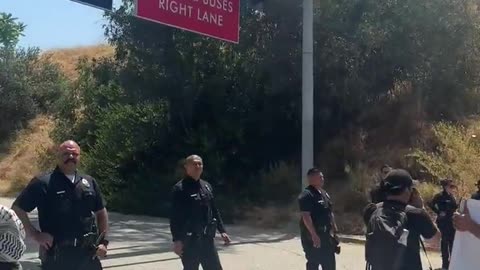 Protesters gathered Thursday at Gate E of Dodger Stadium in Los Angeles, California,