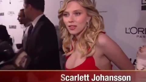 A woman completely disappears behind Scarlett Johansson on the red carpet