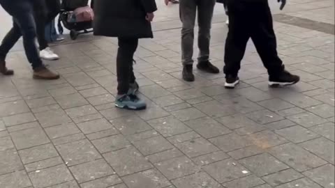 In Utrecht, Netherlands, a white Christian preacher is threatened and beaten by a Muslim