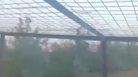 Russian Drone Is Deflected by Cage Armor on a Ukrainian APC