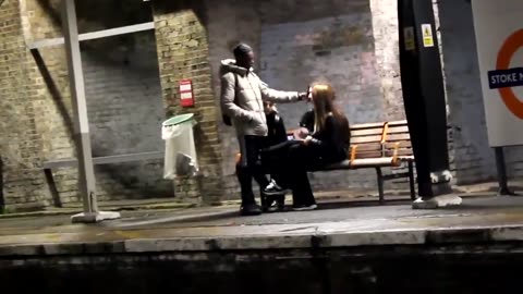 African approaches white woman.. strokes her hair.. asks if she wants to die