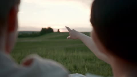 Woman Pointing to the Horizon while Talking to Her Love
