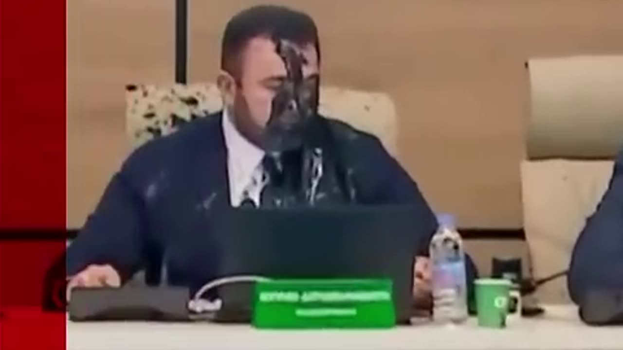 Moment Georgia's election chief is doused in PAINT