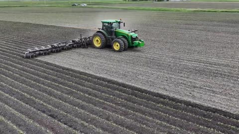 Green Tractor's Day Shift Watch It Dominate the Dark Field!