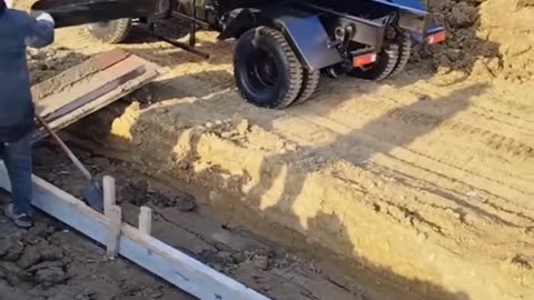 Pouring Concrete with a Small Dump Truck