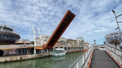 Drawbridge between Cattolica and Gabicce Mare rises for the passage of yachts