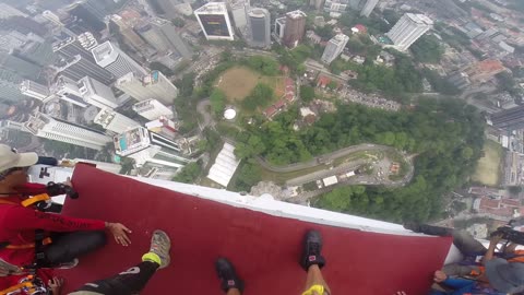 BASE JUMP GOES HORRIBLY WRONG! Andy Lewis Takes a Dramatic 1,200ft Plunge off KL Tower!