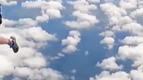 A skydiver's parachute gets caught on plane's tail