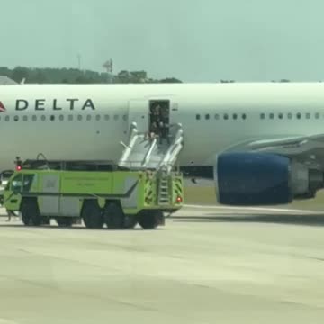 Passengers evacuate Delta Airlines flight at Orlando International Airport