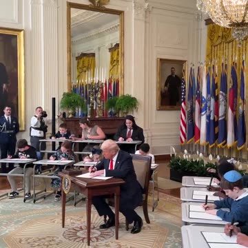 President Donald J. Trump signs an Executive Order to eliminate the