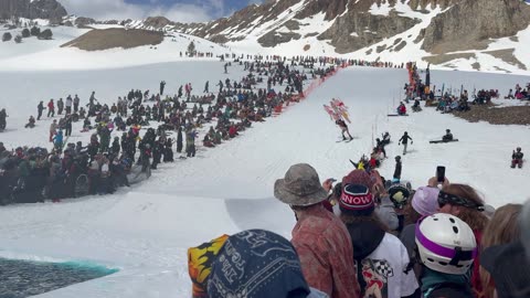 Skier and Inflatable Friends Compete In Pond Skim