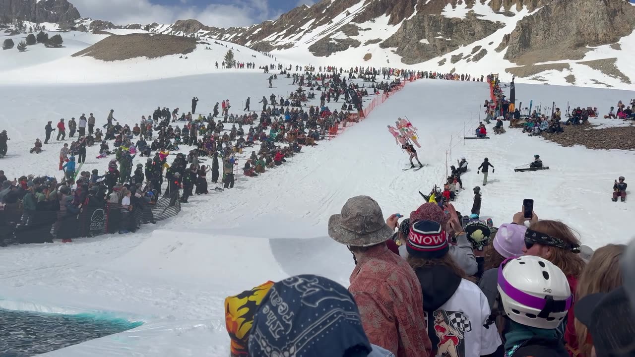 Skier and Inflatable Friends Compete In Pond Skim