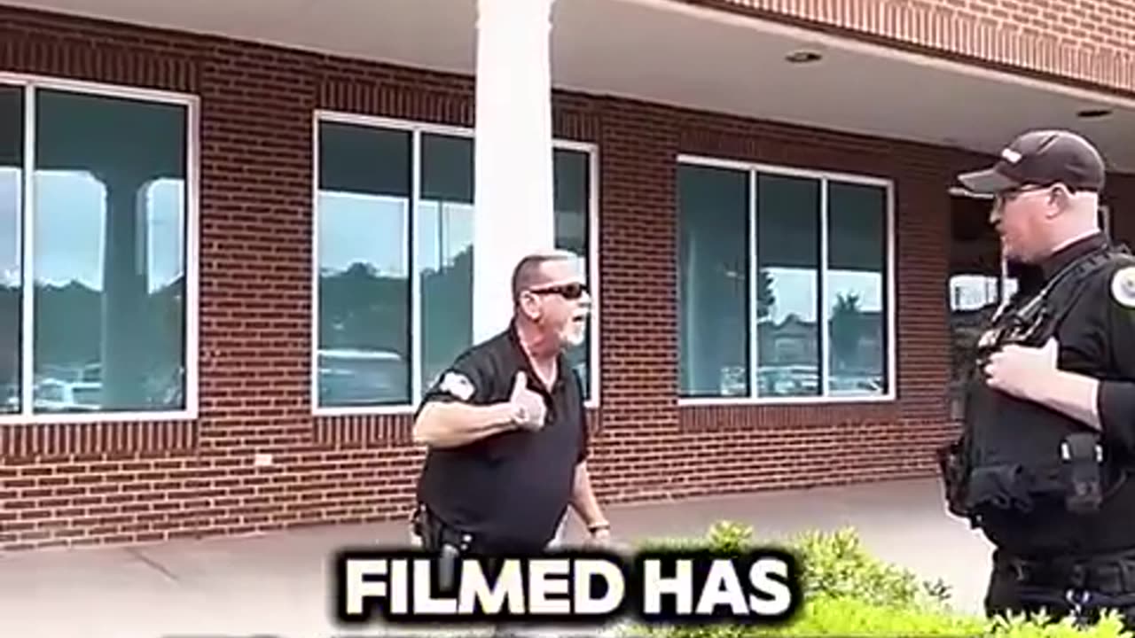 Security guard doesn't realize the rules of the building do not trump laws.