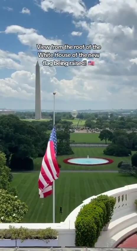 On the roof of the White House, watching the new flag rise.