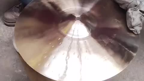 TONGXIANG HOW HANDHAMMERING THE CYMBALS