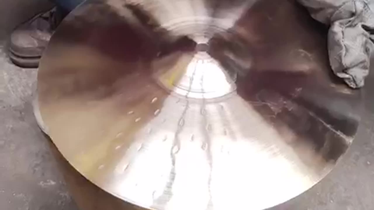 TONGXIANG HOW HANDHAMMERING THE CYMBALS