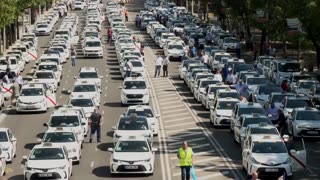 Madrid taxi drivers hold go-slow protest against ride-hailing vehicles